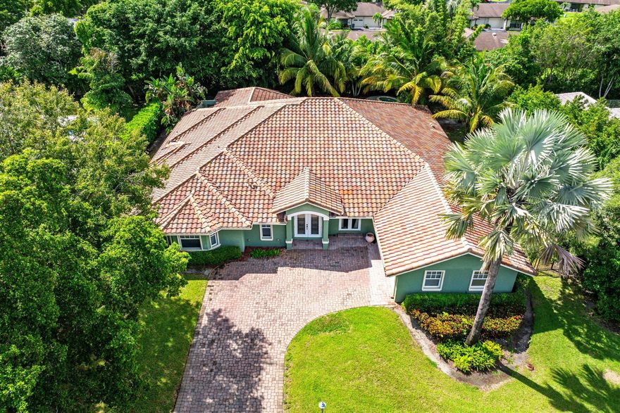 Welcome to a life of tranquility at 10295 St. Andrews Road, perfectly situated within the gated and meticulously maintained community of Pine Tree. Enjoy the quiet, tree-lined streets and low HOA fees. Note: The private Pine Tree Golf Club is located within the gates, however, membership is not mandatory for residents of the community.  This sprawling, single-story pool home offers 4 bedrooms and 4 full bathrooms, with convertible Office and Den for 5th Bedroom, encompassing 5,130 square feet of under-air living space and 6,138 total square feet of covered space. Set on a desirable half-acre lot, this residence represents a tremendous value on a price-per-foot basis.