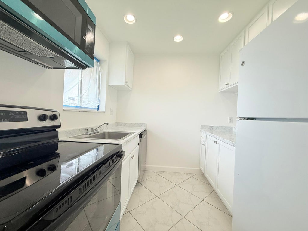 Photo of 6106 FOREST HILL Boulevard #204, West Palm Beach, FL 33415 (MLS # B26055017)