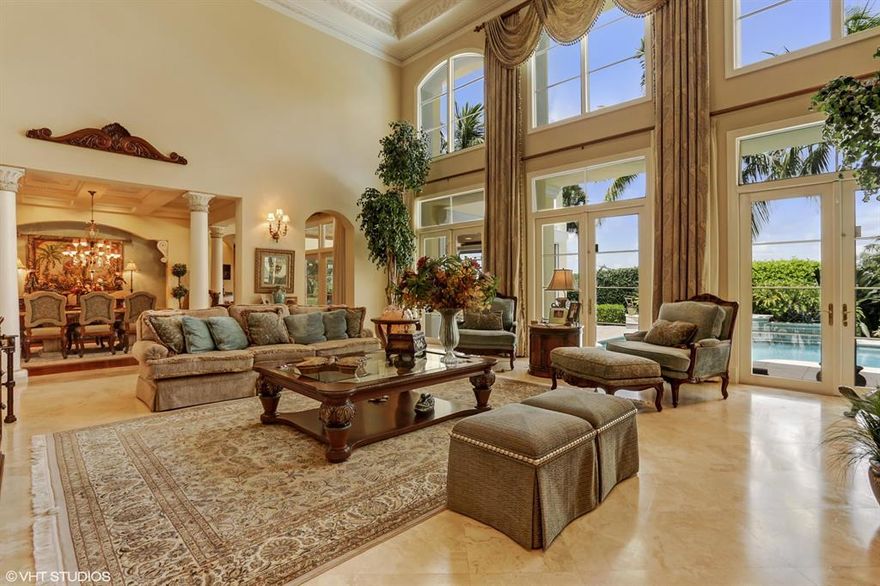 Charming home on one a very rare double wide lot in the exclusive Jack Nicklaus' designed Loxahatchee Club. Consistently considered on par with the most highly ranked clubs in the world, the Loxahatchee Club has only improved it's standing with a recently completed $15 million renovation to the clubhouse. This exquisite golf front home overlooks the 18th fairway, green and the clubhouse. Attention to detail is abundant with coffered ceilings, crown mouldings, marble and Brazilian hardwood flooring.  The chef's kitchen has all top of line appliances  (SubZero, Fisher Pakel, Thermador and Frigidaire) including a double oven, gas cooktop, 350 bottle Eurocave wine closet and 2 granite islands. All the large bedrooms are en suite. Whole house water purification system with instant hot/cool at