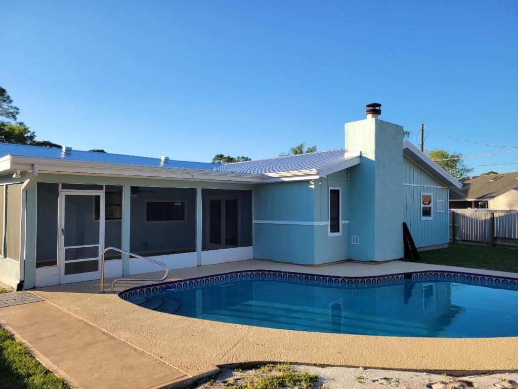 Photo of 2413 SE Whitehorse Street, Port Saint Lucie, FL 34984 (MLS # R10955295)