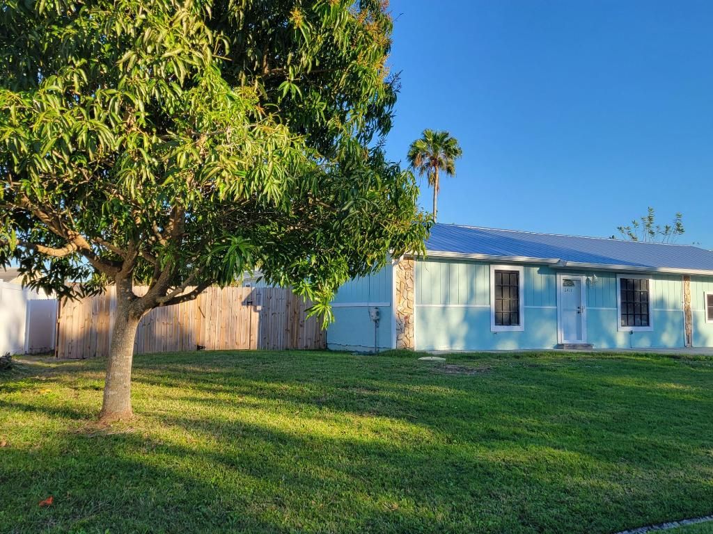 Photo of 2413 SE Whitehorse Street, Port Saint Lucie, FL 34984 (MLS # R10955295)