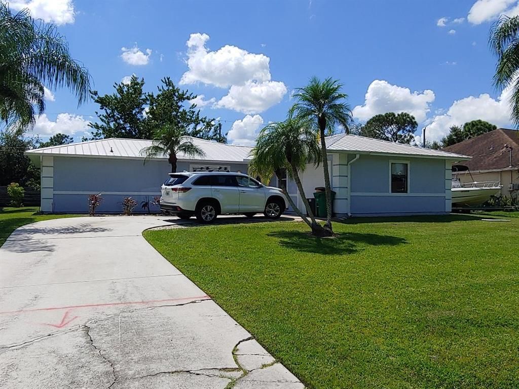 Photo of 1362 SW Crest Avenue, Port Saint Lucie, FL 34953 (MLS # R10804167)