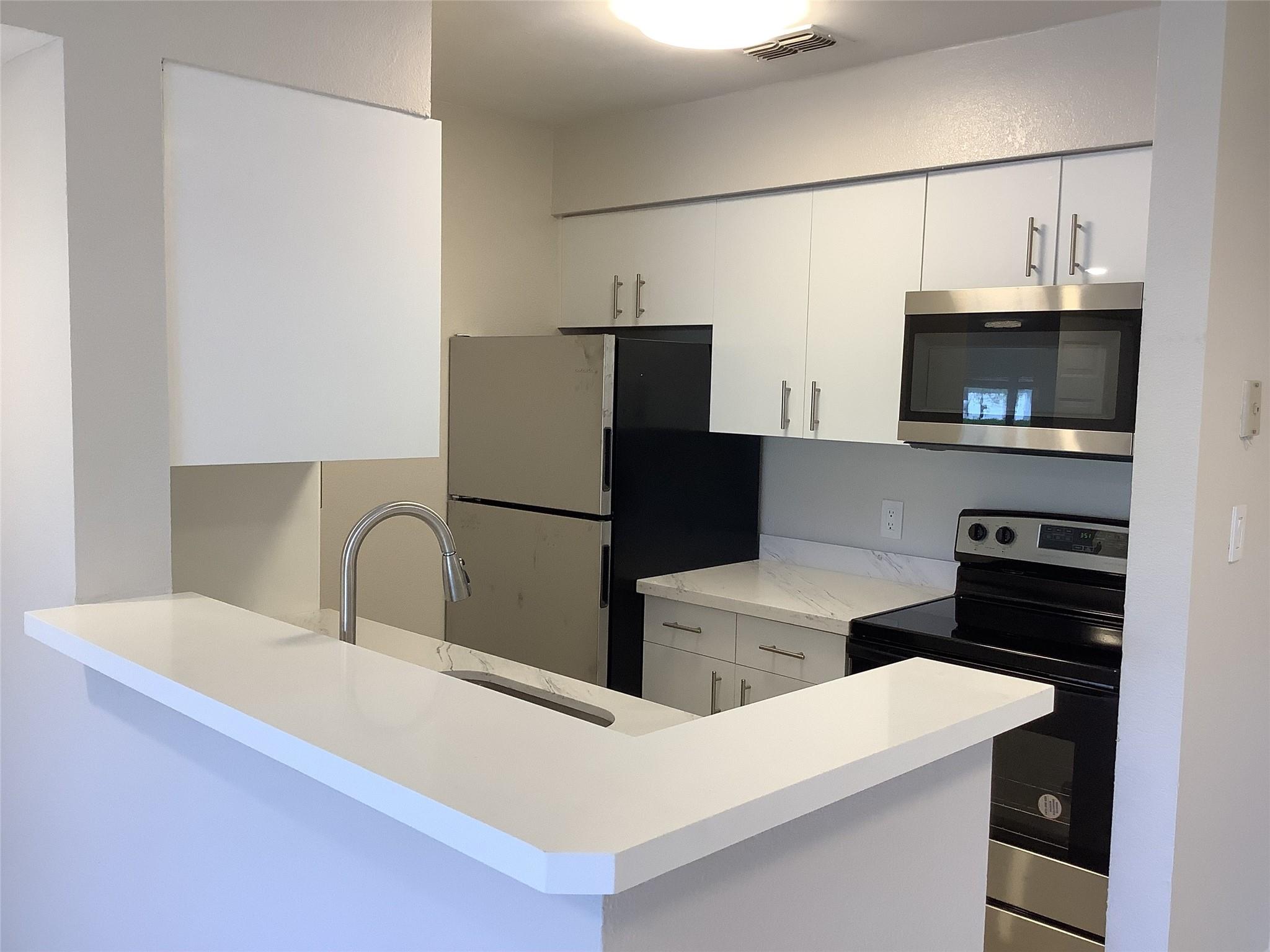 AMAZING FIRST-FLOOR BEING COMPLETELY REMODELED 1-BED, 1-BATH APARTMENT. NEW KITCHEN WITH QUARTZ COUNTERTOP, NEW STAINLESS STEEL APPLIANCES, freshly painted, NEW MODERN LED LIGHTS, new baseboards, and TILE FLOORS. WASHER AND DRYER IN UNIT. CONVENIENTLY LOCATED RIGHT ACROSS FROM NSU MEDICAL SCHOOL AND CLOSE TO SHOPS, RESTAURANTS, AND HIGHWAYS. Sundance community offers OPEN PARKING, a community pool, and a gym. Pets are welcome. Fast approval process. COME AND SEE IT BEFORE SOMEONE ELSE DOES!