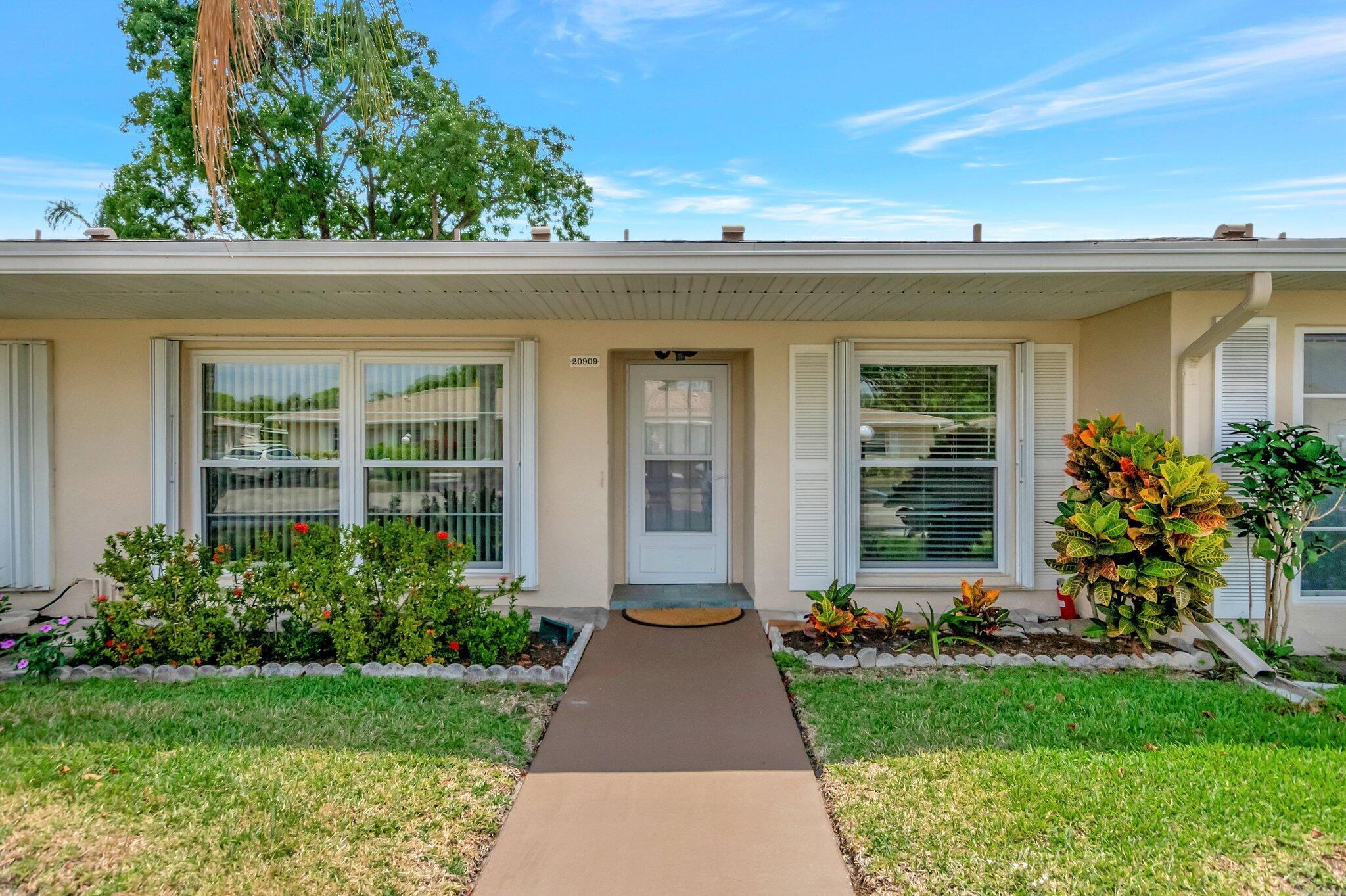 Welcome to Boca Lakes - a 55+ community. Don't miss this beautifully maintained 2 bedroom, 1 & half bath villa in Boca Raton. This home features complete hurricane impact windows, a fantastic eat-in kitchen with granite countertops, a full pantry and new stainless steel appliances. Tile and laminate flooring, a new stackable washer/dryer unit in 2024 and large walk-in closet in the main bedroom. A/C 2011, water heater 2009, new roof in 2022! Conveniently located just west of the turnpike, near shopping and dining and Uptown Boca. Maintenance fees include water, extended cable, roof, security gate and the recreation facility where you'll enjoy tennis, pickleball, bocce, the heated pool, and more.