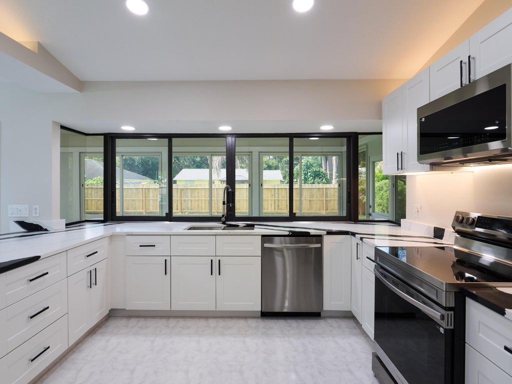 Photo of 672 SW Ewing Avenue, Port Saint Lucie, FL 34983 (MLS # B26052567)
