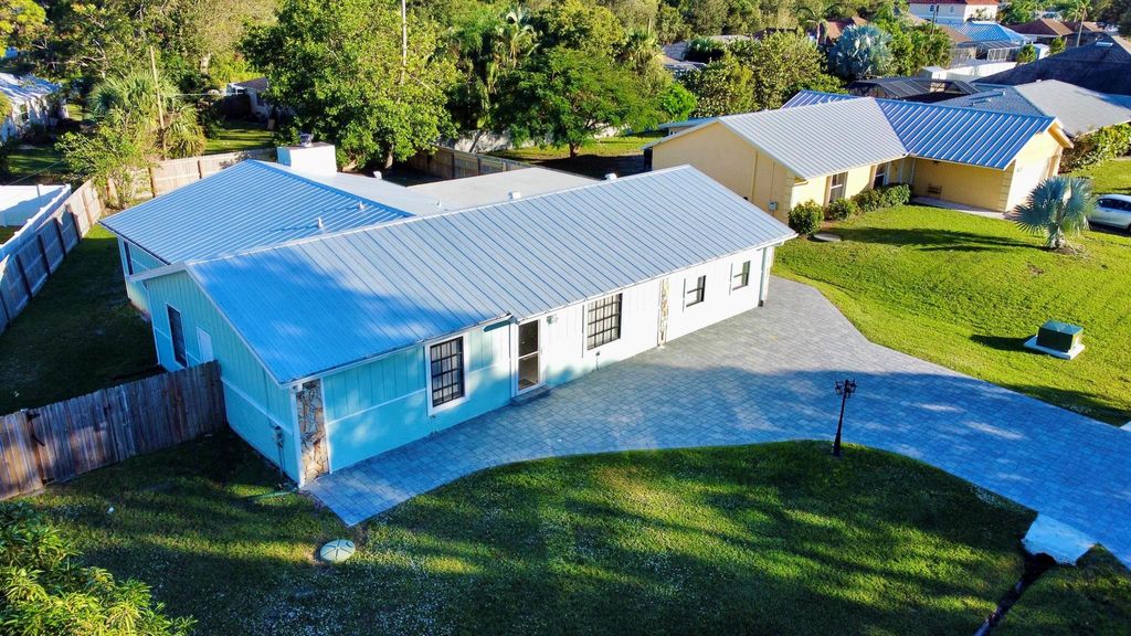 Photo of 2413 SE Whitehorse Street, Port Saint Lucie, FL 34984 (MLS # R11039705)