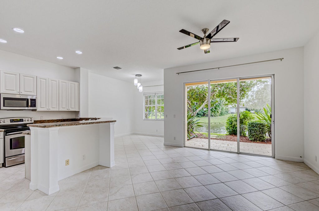 Photo of 402 Commons Way, Palm Beach Gardens, FL 33418 (MLS # B26083445)