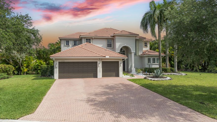 Parkland Isles' Crown Jewel has finally hit the market! This breathtaking 4,000+ SF waterfront estate was renovated with no expense spared, featuring over $500,000 in luxury upgrades. Showcasing stunning European cabinetry throughout, polished porcelain flooring downstairs, designer wood tile upstairs, and a jaw-dropping spa-inspired primary bathroom. The open-concept layout flows seamlessly to your private backyard oasis with a resort-style pool and serene lake views. Located in one of Parkland's most sought-after gated communities with top-rated schools, this home is the definition of luxury living.