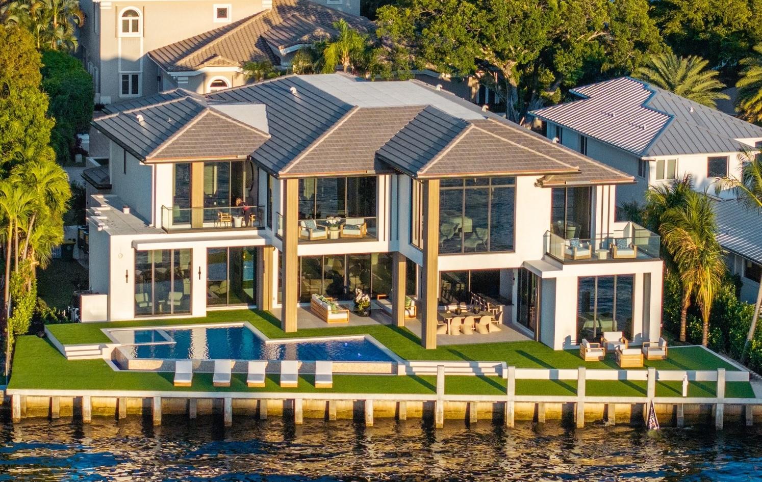 This NEW construction Intracoastal estate completed June 1, 2025 in prestigious Sea Ranch Lakes is a masterpiece of ultra-luxe design. Residents of this exclusive, gated community have peace of mind in this police protected Village. 9,200 total sq ft, all the newest technology, integrating indoor/outdoor living w/sliding glass walls, east/west light filled views and intracoastal breezes. This turnkey home with 110’ of waterfront features elegant millwork, 300 bottle wine display, infinity pool, generous sized bedrooms and bathrooms. Primary bedroom features separate bathrooms & luxurious walk-in closets. Additional features include elevator, clubroom, 3-car garage, boat dock, generator ready & lush landscaping, private Beach Club. Located minutes from prestigious Pine Crest School.