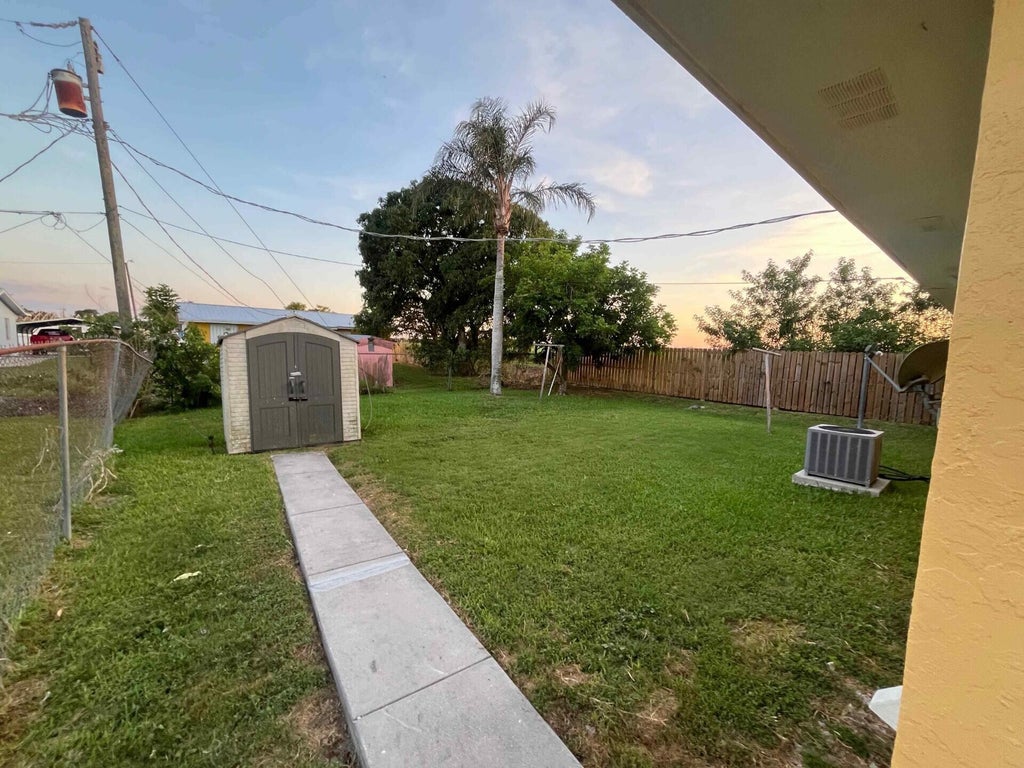 Photo of 442 N Cocoanut Road, Pahokee, FL 33476 (MLS # B26045837)