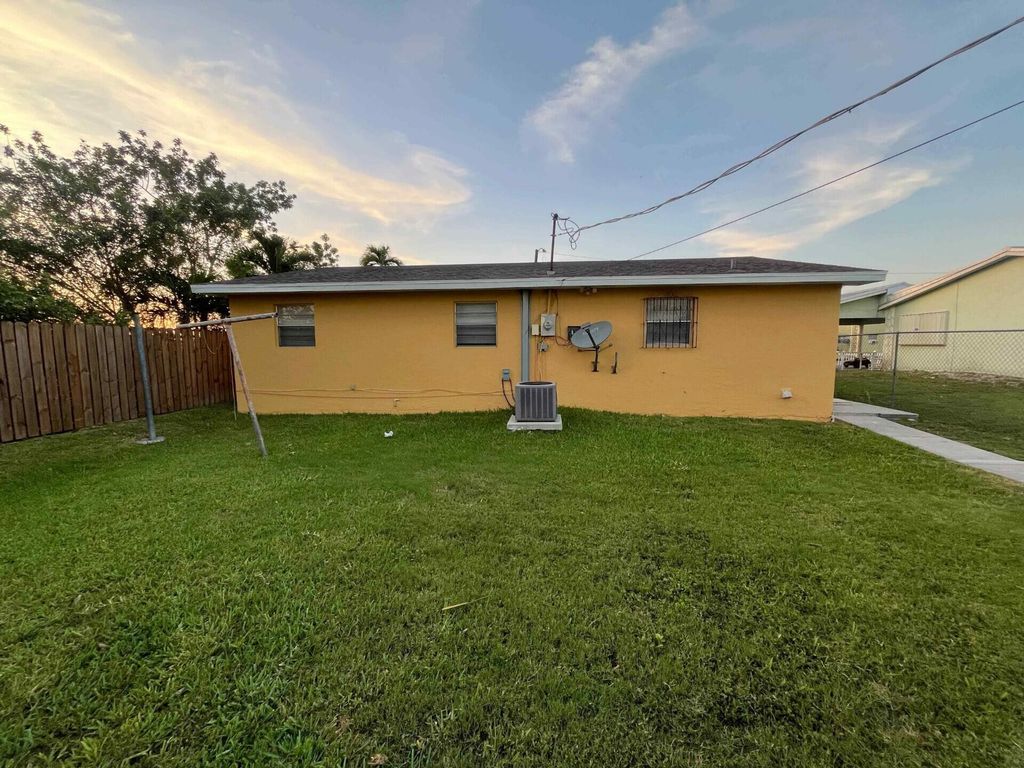 Photo of 442 N Cocoanut Road, Pahokee, FL 33476 (MLS # B26045837)