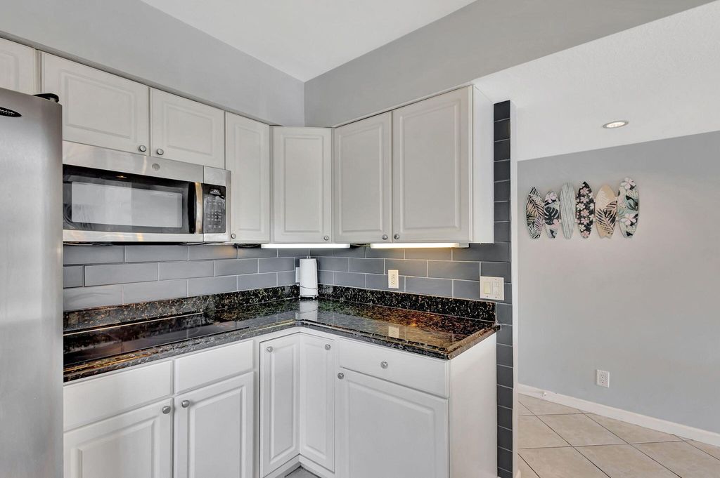 Photo of 1060 Lake Shore Drive #204, Lake Park, FL 33403 (MLS # R11077243)