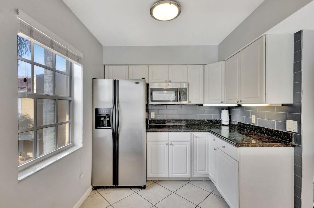 Photo of 1060 Lake Shore Drive #204, Lake Park, FL 33403 (MLS # R11077243)