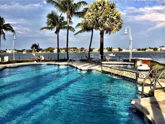 Live like your always on vacation in this resort style gated community located directly on the intracoastal!! This community offers an amazing pool that sits directly on the water watching the boats go by. Enjoy a beautiful marina, clubhouse, state of the art gym, lighted tennis courts, tiki hut, volleyball, business center, dog park & more! This homes is light & bright, Accordion Hurricane shutters, granite countertops & more! This condo is in clean and in move in condition! Close to shopping, I95, & airport.