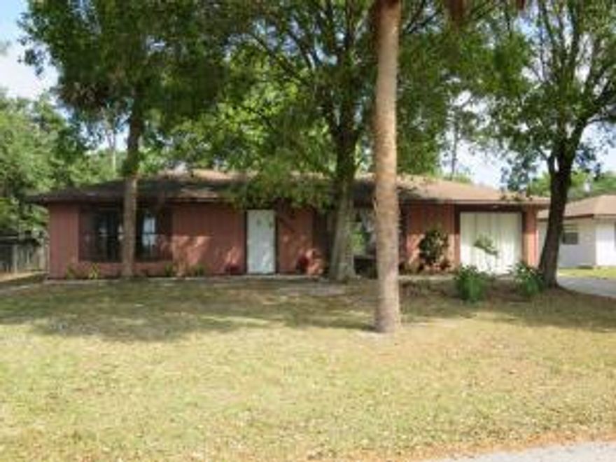 Location, location, location...here is a house with the entire Lakewood Park Regional Park located directly across the street offering a pool, picnic area, jogging trail, ball fields & more.  Home offers volume ceiling, new laminate wood flooring in living area, split plan, fenced yard w/shed & more.  3rd BR is a converted garage.  Originally a 2BR/2BA when built.