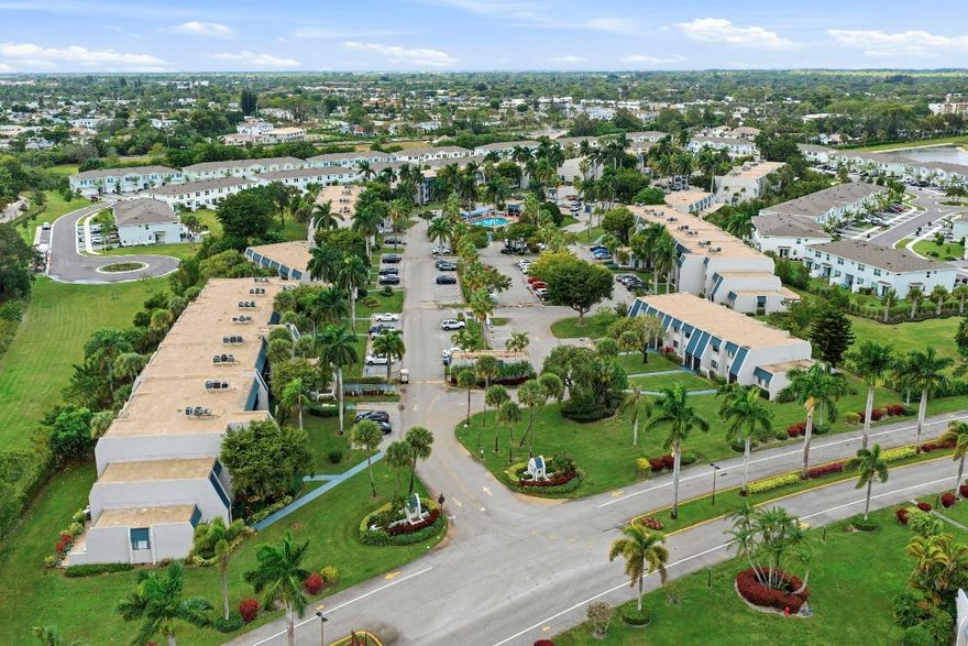 Serene condo with greenery view from a screened in balcony in the well established gated community of ''Fountains of Palm Beach''. This second floor condo with elevator access and a breezeway access offers an open layout and light exposure to both east and west. Enjoy this +55 living section called Trevi Ct while having access to ample things to do in and out of the community. Note that it is a community laundry for the building.