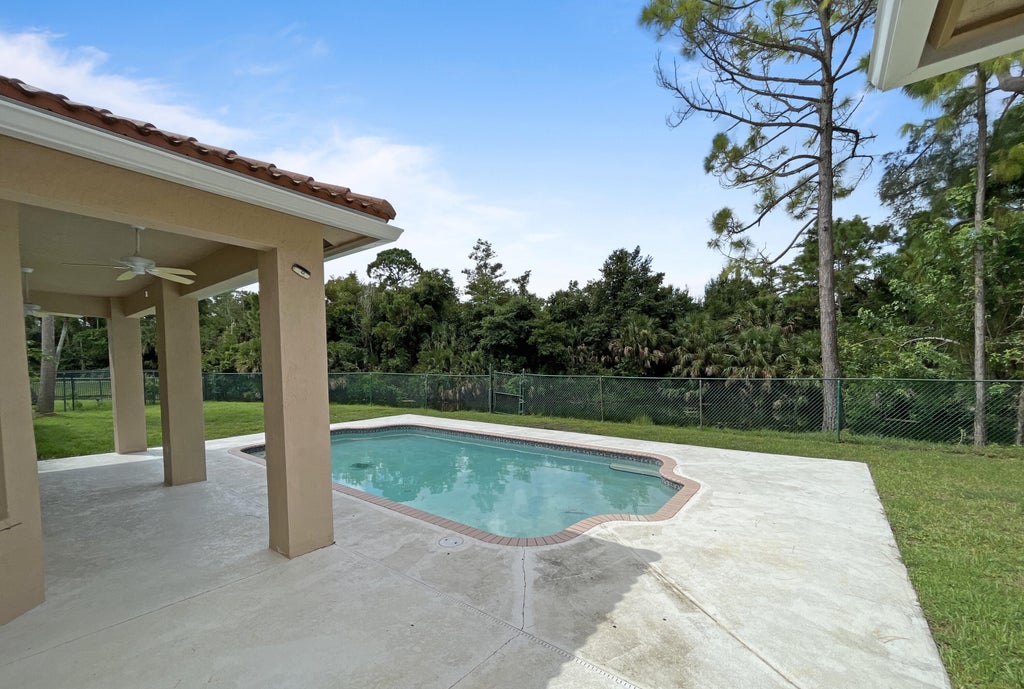 Photo of 124 Sycamore Drive, Royal Palm Beach, FL 33411 (MLS # R11009512)