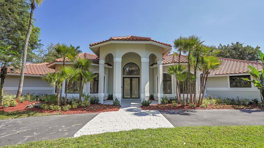 Whispering Woods Estate home on over an acre lot - completely renovated from head to toe - all with permits from the City of Coral Springs. New Roof 2019. All new impact windows and doors, high-end stainless steel appliances, all new flooring throughout, new cabinetry throughout, all new lighting fixtures, new bathrooms, new, new, new!! Must see!...READY FOR MOVE-IN!!!