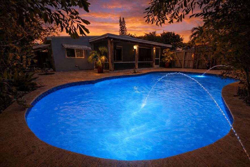 ***Air BnB + VRBO opportunity*** Escape to your stunning resort style salt water pool surrounded by gorgeous travertine pavers & lush tropical landscaping.  Outdoor living at its best complete with a massive screened in patio + BBQ area. The perfect space for entertaining guests. 2020 A/C! All Hurricane impact windows & doors! Charming single story home ready for your personal touches. Open concept layout with attractive finishes every corner you turn. Plenty of room to park with the massive carport + extended driveway space.  NO HOA!! Build an ADU, build your dream home, remodel, or furnish for short term rentals; the possibilities are endless with this oversized 8111 sqft lot. Prime location biking distance from the beach, Las Olas, Galleria Mall, Wilton Manors, shopping & fine dining.