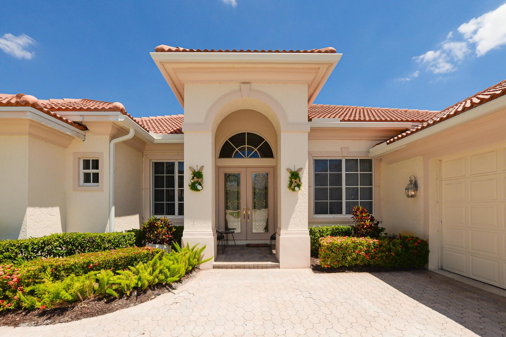 Nestled in coveted Cypress Point/PGA Village. Fabulous Ryder Golf views. This pristine 3 Bedroom, 3 full baths and 2.5 car garage Augusta model CBS home has a new barrel tile roof. It is a golf lover's dream. It has a central vac. Side load golf cart garage. Extended screened patio. Updated landscaping.