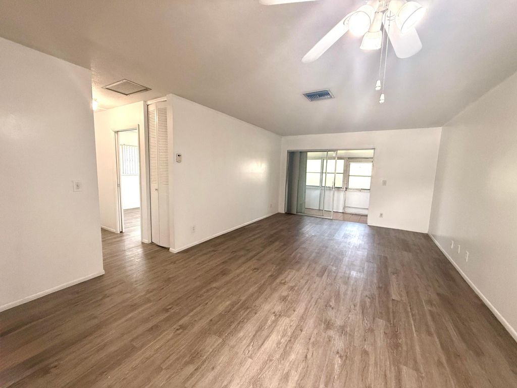 Photo of 2854 E Crosley Dr Drive E #J, West Palm Beach, FL 33415 (MLS # B26023684)