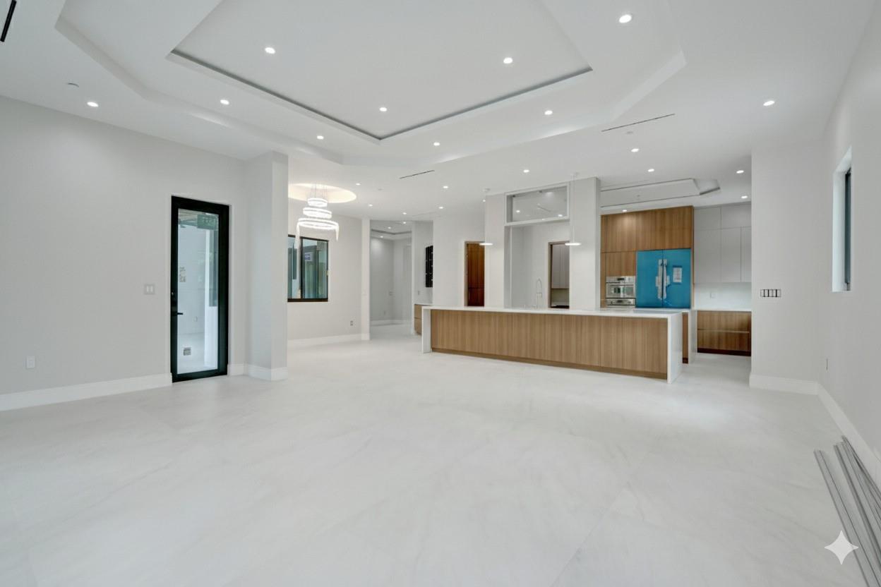 This exquisite New Construction home offers seven bedrooms plus an office, eight bathrooms, and 8,247 sq. ft. of refined living space. Walking through the custom 11-foot front door, you are met with direct views of the pool and a sense of spaciousness with 24 feet of ceiling height. There is a wine room just off the formal dining area and an elevator as you come in through the garage. Three upstairs rooms boast private balconies with serene backyard views. The primary suite is a true retreat, complete with double walk-in closets, a cozy sitting area, a huge master bath, and direct pool access. Other features include an air-conditioned garage, a complete summer kitchen, and a full cabana bath. Centrally located in Plantation Acres.