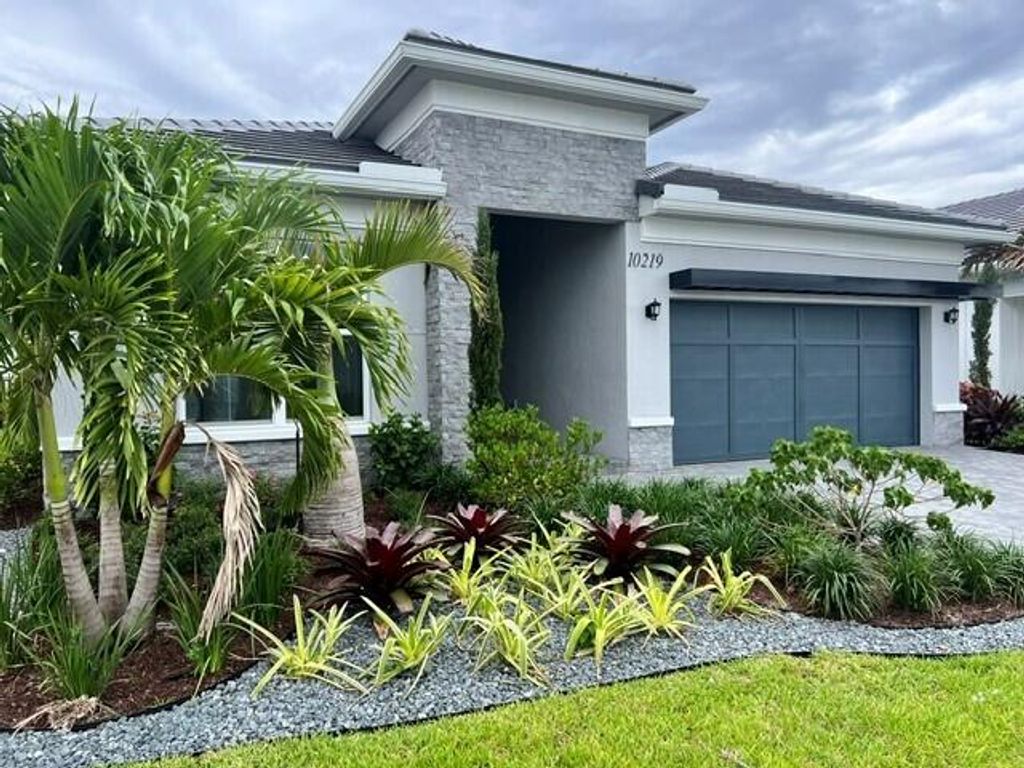 Photo of 10219 Timber Creek Way, Palm Beach Gardens, FL 33412 (MLS # B26035238)