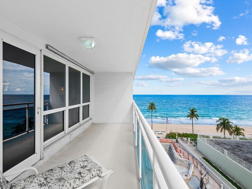 Live the Galt Ocean Mile lifestyle at The Commodore in this spacious south-facing 2-bedroom, 2-bath residence offering sweeping ocean views. With over 1,650 sq ft, this light-filled floor plan features open living and dining areas, impact windows and doors, and direct balcony access to enjoy coastal breezes and sunrise views. The kitchen offers marble countertops, ample cabinetry, and full-size in-unit washer and dryer. The oversized primary suite includes a walk-in closet, additional storage, and dressing area. The guest bedroom is bright and welcoming for visitors or flexible use as a home office. Resort-style amenities include 24-hour security, heated pool, fitness center, clubroom, and direct beach access. Exceptional value on Fort Lauderdale Beach.