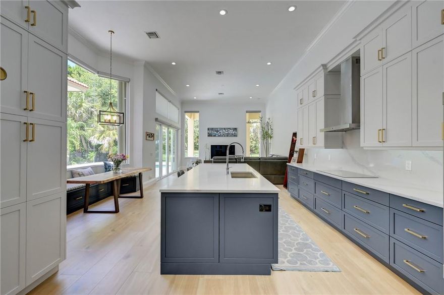 WOW!! This 5 bed, 3 bath SFH in The Vistas @ Heron Bay has been completely renovated, featuring a chef's kitchen w/ seamless quartz countertops & backsplash, SS appliances, cabinets w/ lighting & pullout drawers, island w/ storage & built in wine fridge, & LED lights throughout. All 3 bathrooms have new vanities, sinks, & showers. Enjoy the completely fenced in outdoor oasis featuring a sparkling pool w/ travertine tile around the pool & back patio, a custom built outdoor kitchen & bar w/ a Bull Grill & Beverage refrigerator. For added protection, this home features impact strength double doors & accordion shutters all around, with brand new remote control operated window treatments & drapes. Close to all Top Rated Schools, Sawgrass Expressway, & Great Dining, this home won't last long! 2 New AC's, New High End GE Monogram appliances. Low monthly Maintenance gets you two gyms, two resort style swimming pools, Huge Tennis community, Basketball, Splash pad for your children, playground, 3 Security Gates and so much more! This is truly a Family friendly community. Nothing left to do here but bring your toothbrush.