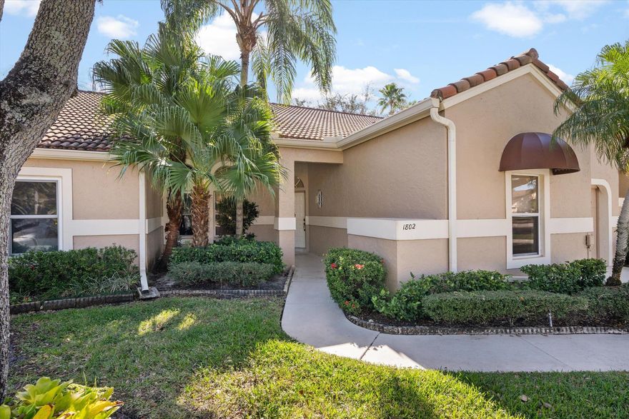 Spacious 2-bedroom single-story villa in a split floor plan (with a 1-car garage) in the Heather Run neighborhood within PGA National.  With high ceilings and skylights in the great room, this villa has wonderful natural light.  The primary bathroom was renovated and expanded in late 2023 to make it handicapped accessible, while the kitchen and guest bathroom were previously updated.  There is neutral-colored tile in the main living area and new luxury vinyl flooring in both bedrooms. The HOA is responsible for maintenance, repair & replacement of the roof (as well as exterior painting). The community pool is across the street and the community allows each residence to be rented 2 times per year (with a 90-day minimum term).