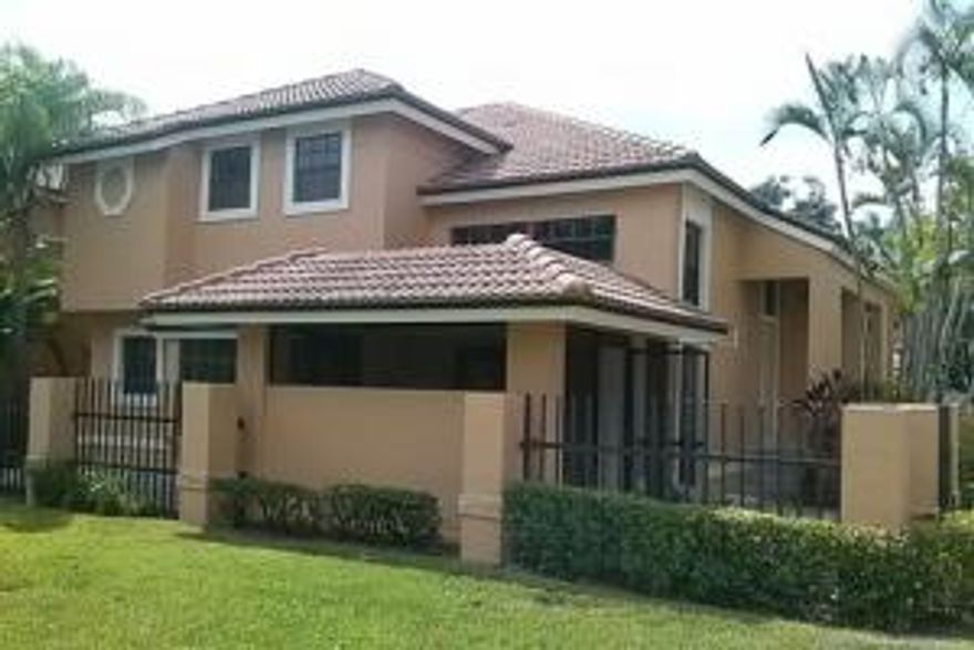 Come and enjoy all that south Florida has to offer, this town home has the feel of a single family home with 2 separate patio spaces along with a screen in patio for reading and relaxing. This property also allows you to BBQ and is perfect for entertaining friends and family. A unique step down living room provides adequate space with an open layout vaulted ceilings and plenty of light with view of the kitchen. The first bedroom is downstairs off the kitchen and also a full bathroom downstairs which is great for quests. With the Master bedroom upstairs this split plan gives great privacy and opens up to a very large master with a his and her closets, Jacuzzi tub, and double vanity. Community provides pool and has man gated entrance. This property is a great deal and won't last long!