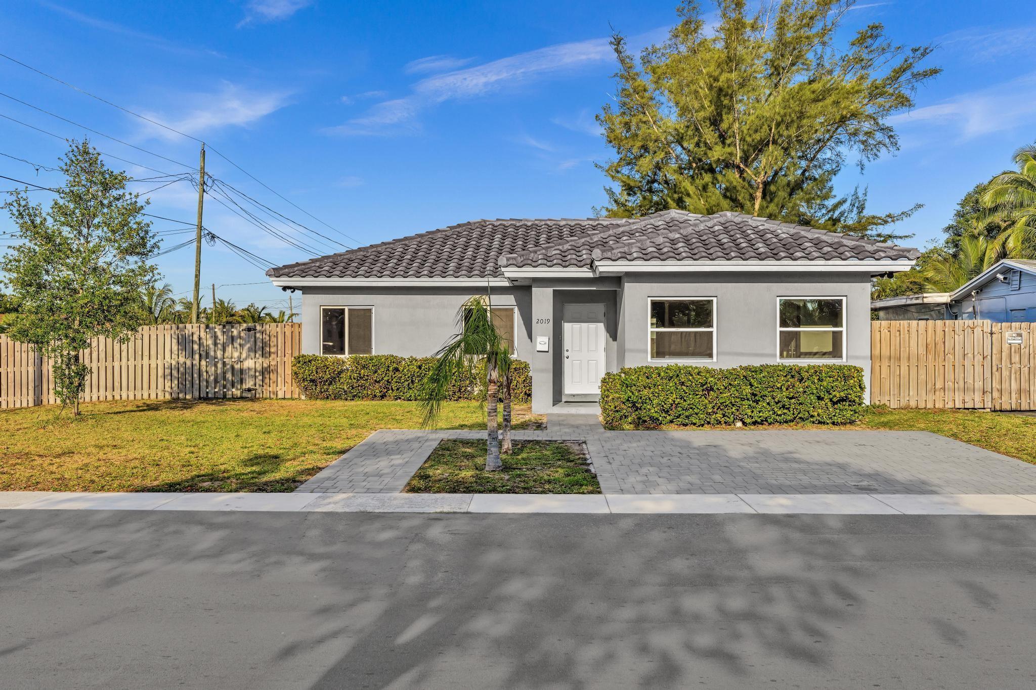 Now for rent in Sunrise! This modern 2022-built home features 4 bedrooms + a additional room, 2 full bathrooms, and a spacious primary suite with a huge closet. Enjoy peace of mind with hurricane impact windows, a gray barrel tile roof, and no HOA. The large fenced corner lot offers plenty of outdoor space, and there's a separate laundry room, tankless water heater, and ample parking with a gray paver driveway. Located near shopping, dining, and highways. accepting Government-Assisted Housing. Don't miss this newer home in a prime location--available now!
