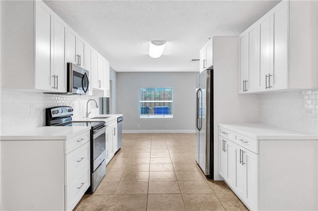 Photo of 8221 SW 3rd Court, North Lauderdale, FL 33068 (MLS # B26001369)