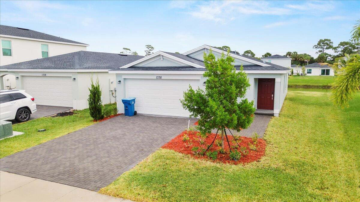 Beautiful brand-new home with lake view located in the desirable Tillman Lakes community of Palm Bay. This modern single-family residence offers 3 bedrooms, 2 full bathrooms, and a 2-car garage, featuring new appliances, elegant finishes, and a brand-new A/C system. The open floor plan with abundant natural light provides a comfortable and functional living space. Conveniently located near top-rated schools, hospitals, shopping centers, and I-95. Important: Only first month's rent and security deposit required. Tenant responsible for lawn maintenance. Move-in ready!