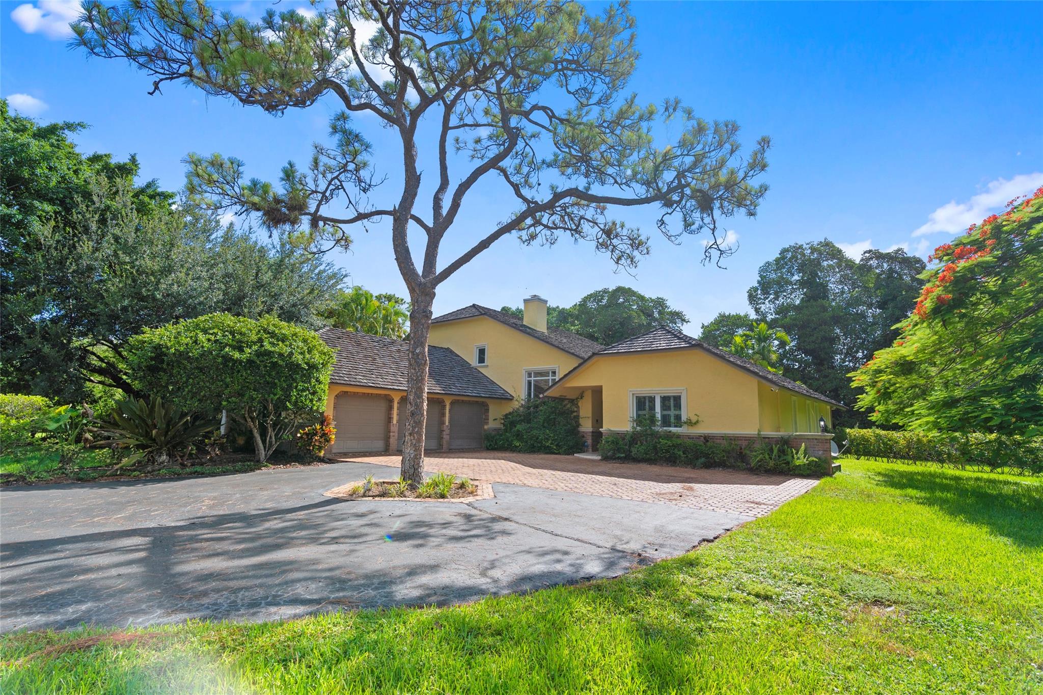 Escape the chaos and embrace luxury living in the highly desirable community of Ponderosa of Loggers’ Run. Nestled on OVER AN ACRE of lush private land at the end of a quiet cul-de-sac, this elegant 4BR, 2.5BA estate offers 3,272 sq ft of open living space. Inside are soaring ceilings, sun-filled rooms, a chef’s kitchen with premium Wolf gas stove, and sleek upgrades throughout. Features impact windows/doors and 3 newer A/Cs. The 3-car garage adds ample storage. The backyard is perfect for those seeking space and serenity, with a resort-style pool, room to grow, roam, entertain, or simply relax. This home offers a rare blend of countryside charm and refined comfort. Community has tennis, baseball, soccer, parks. Zoned for A rated public schools. Right in Boca, yet worlds away. A true Gem!