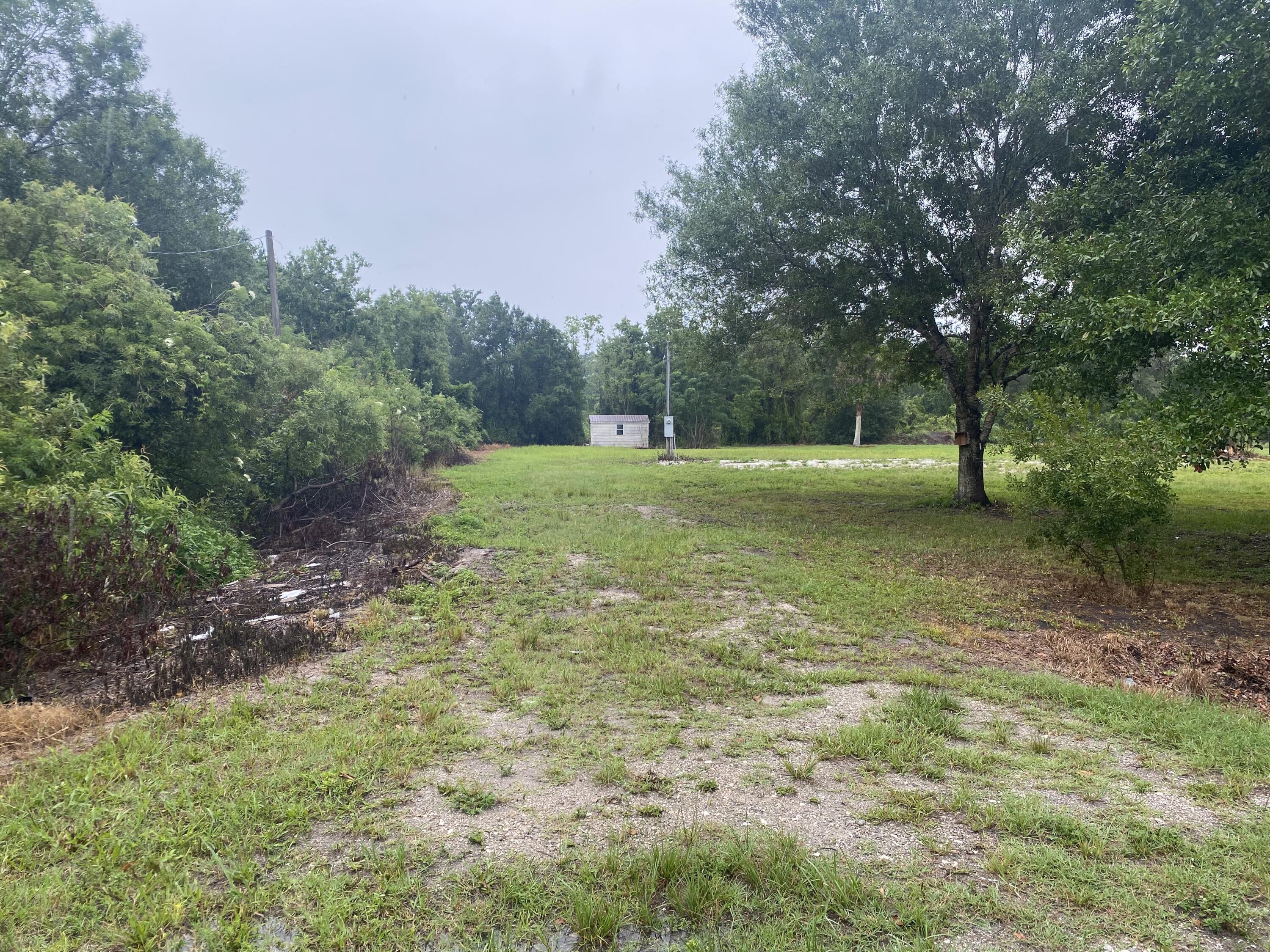 Build or bring your dream home and barn on this beautiful and private high and dry 2.5 acre on a paved road with a culvert pipe to access your property power, well and septic already on the property also the shed comes with it So much to enjoy in Okeechobee County. Come to The Kissimmee River Preserve State Park S West of this area as well is the Kissimmee River. The Kissimmee river flows into Lake Okeechobee and is well known for some of the best fishing. whether you like Fishing, hunting ,mudding agriculture or just privacy here you have it all. owner financing available