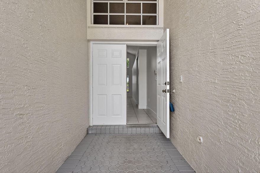 Welcome to this beautifully maintained home in the highly desirable Silver Lakes community in West Miramar. Featuring soaring ceilings and abundant natural light, this updated residence offers a bright, modern feel with newer flooring, upgraded bathrooms, and designer lighting. The open-concept layout flows seamlessly through the spacious living and dining areas, perfect for entertaining. The updated kitchen features granite countertops, solid wood cabinetry, and stainless steel appliances. Enjoy a functional layout with a first-floor primary suite, guest bathroom, and separate laundry area. Relax in the private backyard with patio space perfect for morning coffee. Conveniently located near top-rated schools, parks, shopping, major highways and a community pool.