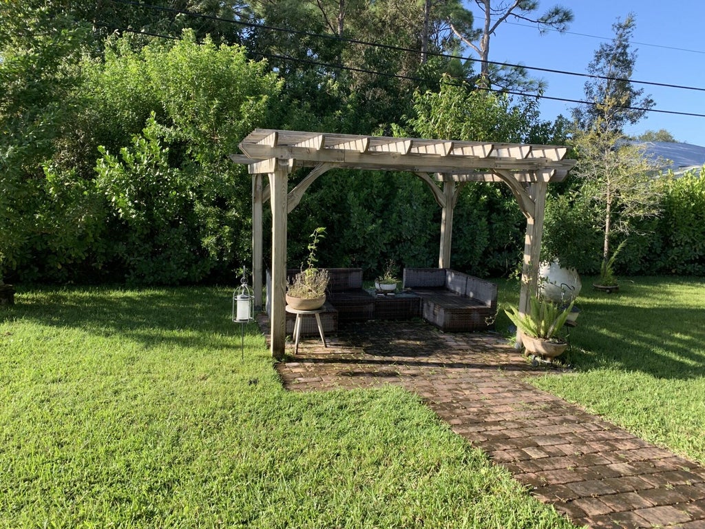Photo of 1474 SW Leisure Lane, Port Saint Lucie, FL 34953 (MLS # R11135578)