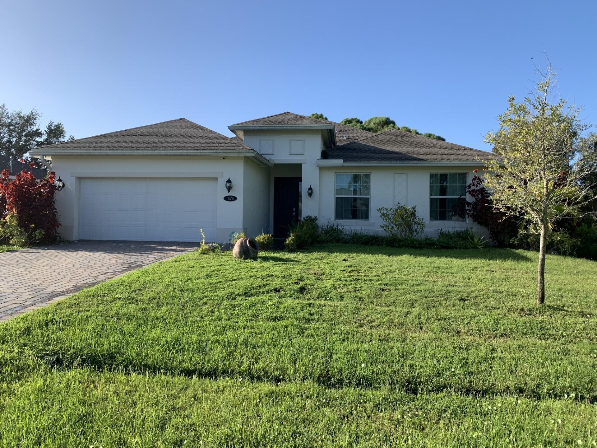 4/3/2 CBS home located in a desirable location close to schools, shopping, I95, turnpike, hospitals, Traditions, and local beaches.  The home features tile throughout the main living areas, 12'' ceilings, hurricane impact windows, quartz countertops, s/s appliances, security system, sprinkler system on a separate well, gutters, paved driveway and patio, and the solar panels will be paid by the seller at closing.  All of the appliances and the living room and master bedroom tv's convey.  Don't miss this one!!