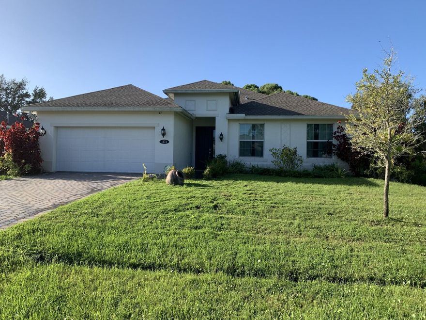 4/3/2 CBS home located in a desirable location close to schools, shopping, I95, turnpike, hospitals, Traditions, and local beaches.  The home features tile throughout the main living areas, 12'' ceilings, hurricane impact windows, quartz countertops, s/s appliances, security system, sprinkler system on a separate well, gutters, paved driveway and patio, and the solar panels will be paid by the seller at closing.  All of the appliances and the living room and master bedroom tv's convey.  Don't miss this one!!