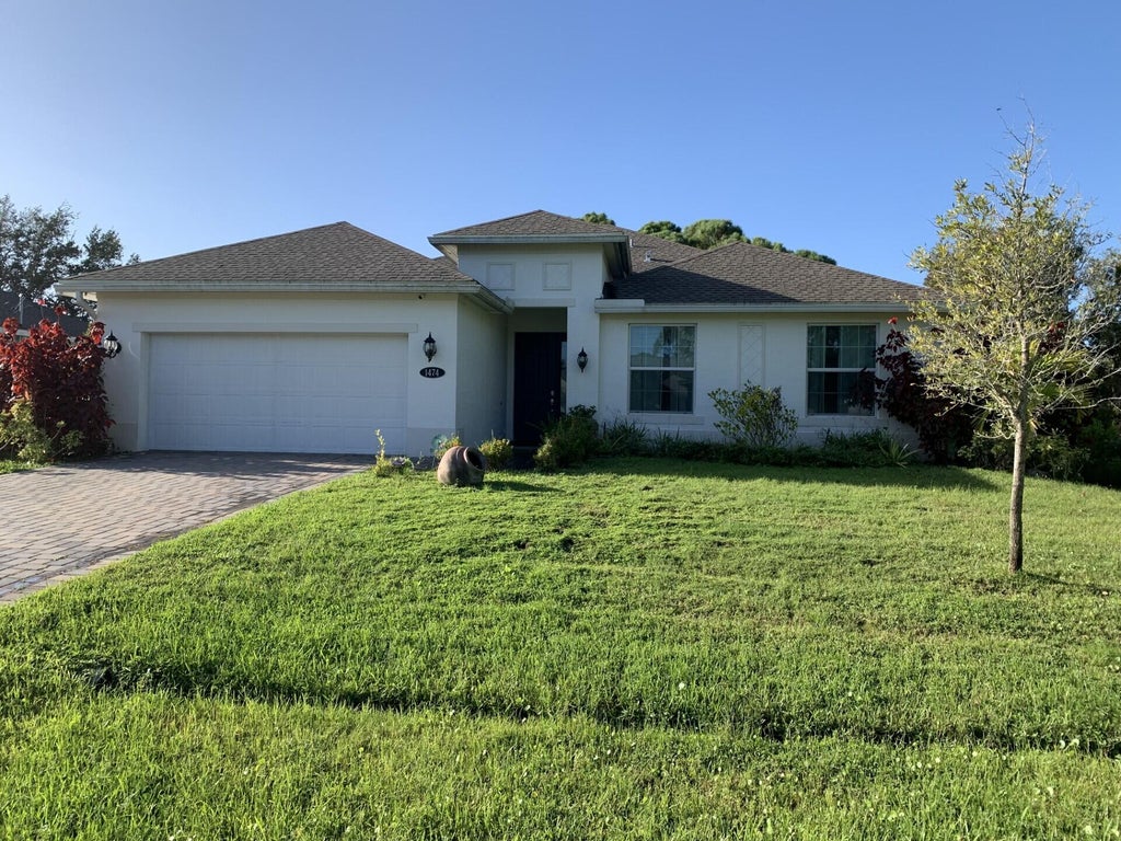 Photo of 1474 SW Leisure Lane, Port Saint Lucie, FL 34953 (MLS # R11135578)