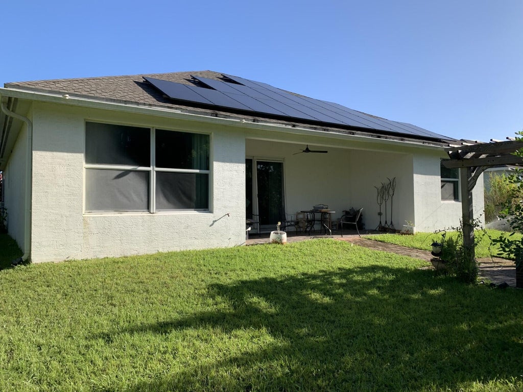 Photo of 1474 SW Leisure Lane, Port Saint Lucie, FL 34953 (MLS # R11135578)