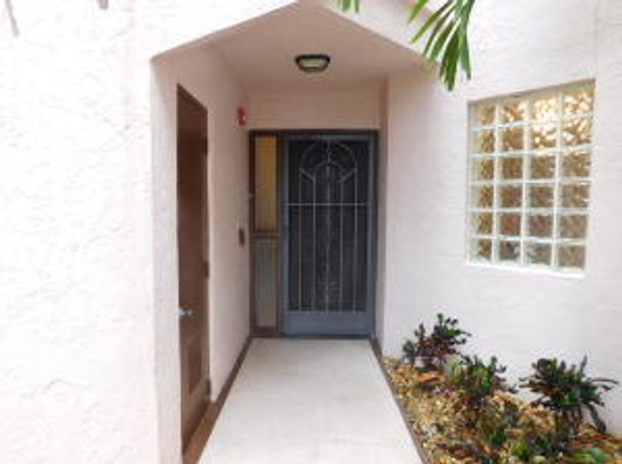 Charming first floor 3 bedroom 2 bath spacious condo in pristine move-in condition! The split bedroom floor plan provides privacy for you and your visiting guests. Eat-in kitchen. Lots of storage including private outside storage room and mirrored closets throughout. Transferrable appliance service agreement expiring in December 2016. This unit is perfect for wonderful vacations, snowbirds or full-time Florida living. Hurry fast because this condo has been priced to sell! Platina is a resort-style community offering wonderful amenities. The active clubhouse has a performing arts theater, cafe open for breakfast and lunch, card rooms and fitness center. With shows, bingo, and an array of clubs, you will not be bored! Resort style swimming pool as well as satellite pools and tennis courts. (Please note that the clubhouse is currently closed for repairs. The cafe and swimming pool remain open.) 24-hour guard gated community. Convenient access to I-95 and the Florida Turnpike. Close to shopping and wonderful restaurants.