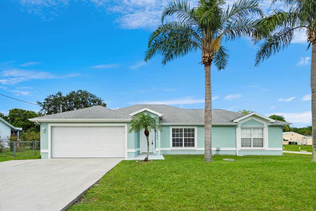 Photo of 2297 SE Marsh Avenue, Port Saint Lucie, FL 34952 (MLS # B26050334)