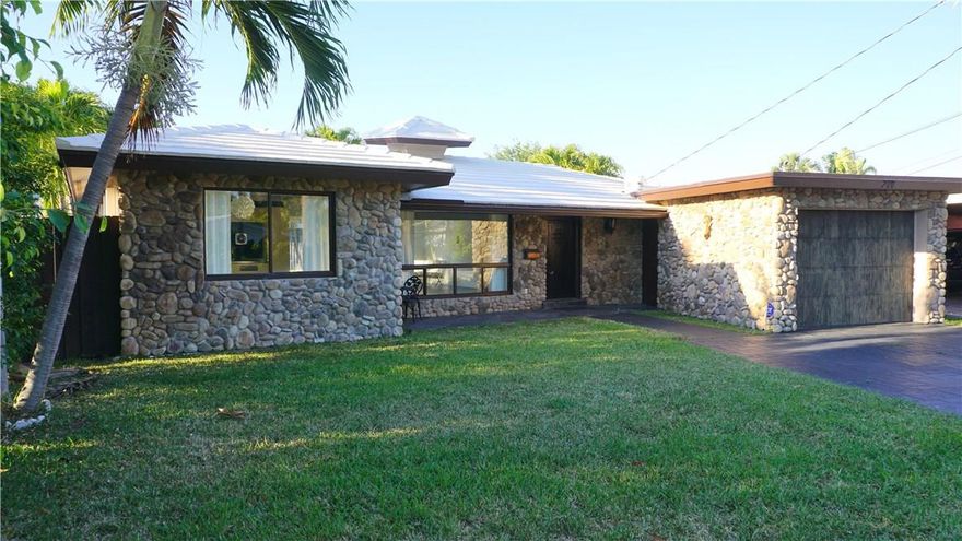 WOW MID CENTURY MODERN HOME ! This amazing 2 bdrm 2 bathroom with LAGOON POOL,RIVER ROCK FRONT,remodeled single family home. Upgrades include 24 X 24 inch slate tile throughout, 1950's kitchen with newer appliances, completely remodeled bathrooms, everything freshly painted .Walk to the ocean  and intercoastal and Lauderdale by- the- sea, shops, pier,live music ,tons of amazing restaurants.You will feel like your on vacation all year.