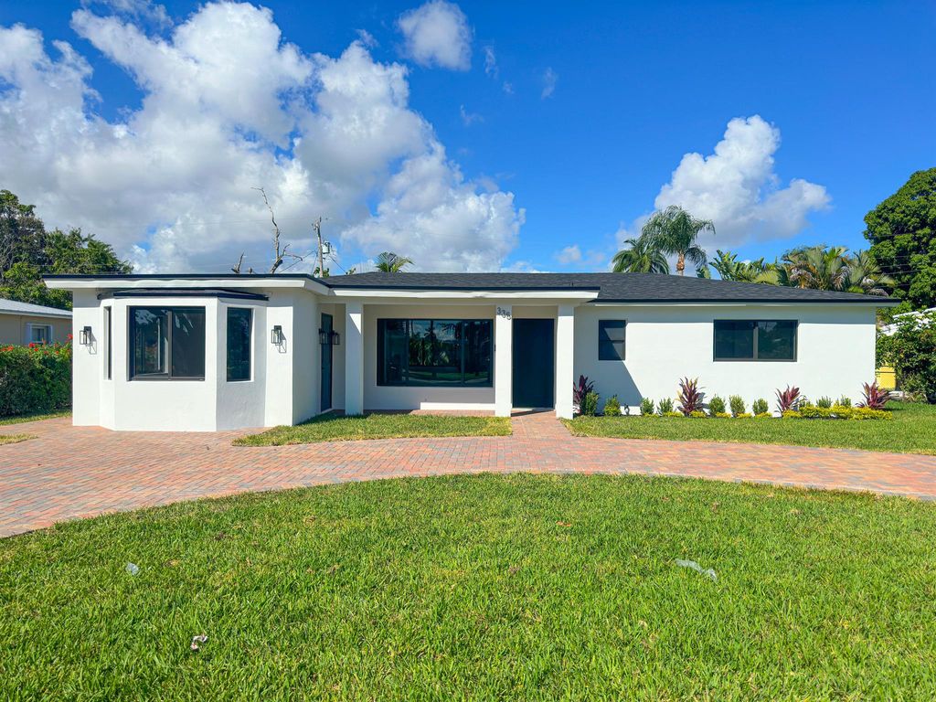 Photo of 335 Flagler Boulevard, Lake Park, FL 33403 (MLS # R10935405)