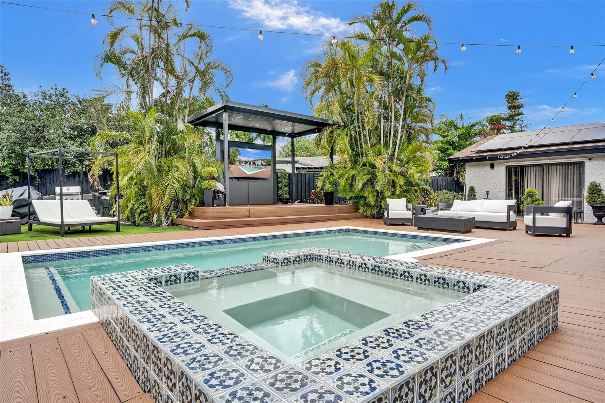 Luxurious 4BR smart home for annual lease in exclusive Palm Aire Village, tucked away on a quiet cul-de-sac. Fully remodeled with soaring vaulted ceilings, spacious bedrooms, and a gourmet kitchen with high-end finishes. The resort-style backyard is an entertainer’s dream, featuring a heated pool, spa, sauna, large putting green, artificial turf, two covered patios, multiple outdoor TVs, pool table, and luxury day-club-style furnishings—all set against a tranquil waterway. Solar panels and a 2-car garage with smart charger. Backyard furnished; interior unfurnished. No subleasing. Available starting September 1, 2025!