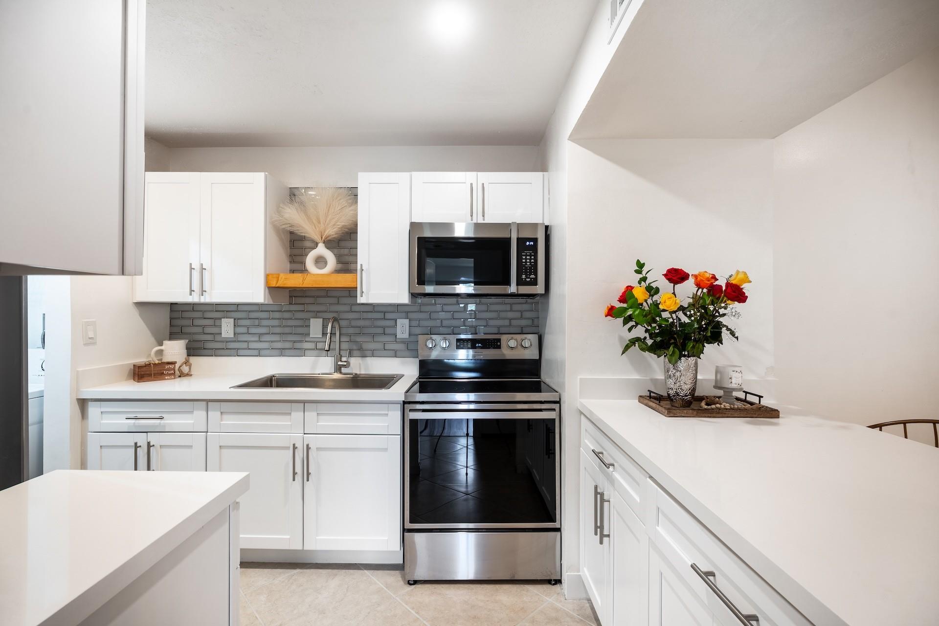 Welcome Home! This beautifully updated 2-bedroom, 2-bath condominium combines comfort, style, and convenience in the sought-after man-gated community of Carmel at the California Club. Step inside and enjoy a thoughtfully designed floor plan featuring a spacious living area, no carpet, and smooth ceilings with no popcorn finish. The modern kitchen shines with brand-new cabinets, quartz countertops, new stove, and a new microwave, while a 2024 refrigerator adds peace of mind. Both bedrooms offer generously sized closets, and the full-size washer and dryer add everyday convenience. Relax on your private screened-in patio or take advantage of the sparkling community pool. This pet-friendly community allows one pet (up to 20 lbs). Please note: New owners must own for four years before renting.