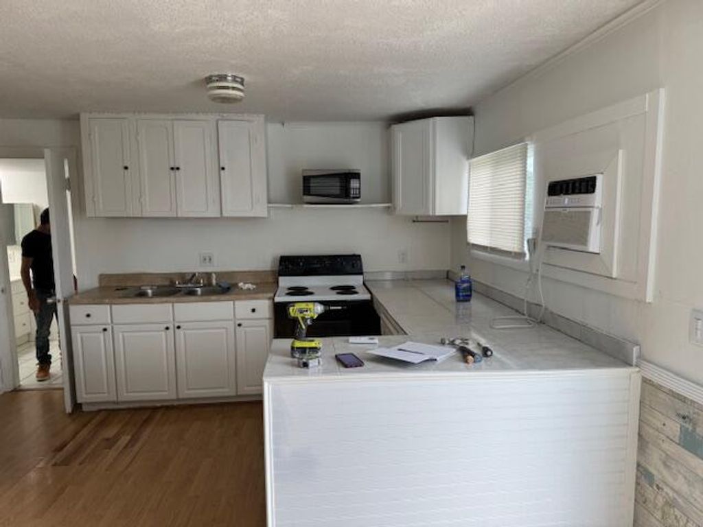 Photo of 2234 NE Pine Ridge Street, Jensen Beach, FL 34957 (MLS # R11069686)