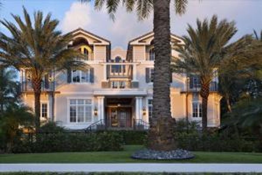 Wondrous sunrise and sunsets highlight the Ocean and Intracoastal views surrounding this estate from its high elevation in walled and gated privacy.  Devoted to outdoor entertaining, the immense backyard enhanced by Italian marble oceanfront terraces span the fireplaced south loggia and north loggia with summer kitchen, in the midst of fountains jetting into the luminescent Diamond-Brite pool and spa.  Another gate accesses the 70+/--foot full-service dock with 30,000-pound Neptune boat lift.